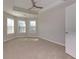 Bedroom featuring carpeted floors and a tray ceiling at 1368 Fall River Dr, Conyers, GA 30013