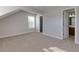 Neutral bedroom with plush carpet, a walk-in closet, and an ensuite bathroom at 1368 Fall River Dr, Conyers, GA 30013