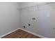 Laundry room featuring wood floors and a wire shelf at 1368 Fall River Dr, Conyers, GA 30013