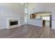 Open-concept living room flows into the kitchen, featuring a fireplace at 1368 Fall River Dr, Conyers, GA 30013