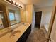 Bathroom features a double sink vanity, tub, shower, and tiled floors at 203 August West Way, Lawrenceville, GA 30046