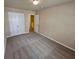 Bedroom featuring neutral walls, carpet, and white doors to hallway and closet at 203 August West Way, Lawrenceville, GA 30046