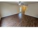 Spacious living room featuring wood floors and natural light at 203 August West Way, Lawrenceville, GA 30046