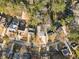 Bird's eye view of a home in a neighborhood surrounded by mature trees and lush greenery at 1045 Shepherds Ne Ln, Atlanta, GA 30324