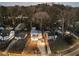 Aerial view of modern home, showcasing its location within a neighborhood surrounded by mature trees at 1045 Shepherds Ne Ln, Atlanta, GA 30324
