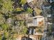 Top-down view of a home with adjacent lot, located in a tree-filled community at 1045 Shepherds Ne Ln, Atlanta, GA 30324