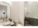Modern bathroom featuring a glass-enclosed shower, sleek fixtures, and a vanity with ample counter space at 1045 Shepherds Ne Ln, Atlanta, GA 30324