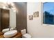 Bathroom features modern lighting, vessel sink, dark tile accent wall, and a large mirror at 1045 Shepherds Ne Ln, Atlanta, GA 30324