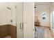Contemporary bathroom showcasing a glass shower, light fixtures, and access to the bedroom at 1045 Shepherds Ne Ln, Atlanta, GA 30324