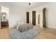 Bedroom with neutral tones, modern ceiling fan, and ensuite bathroom with modern decor at 1045 Shepherds Ne Ln, Atlanta, GA 30324