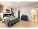 Comfortable bedroom featuring a queen-sized bed, dresser, and windows at 1045 Shepherds Ne Ln, Atlanta, GA 30324