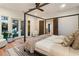 Bright bedroom with outdoor access, featuring a four-poster bed and neutral decor at 1045 Shepherds Ne Ln, Atlanta, GA 30324