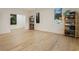 Large bonus room featuring beautiful hardwood floors, natural lighting, and shelving for storage at 1045 Shepherds Ne Ln, Atlanta, GA 30324