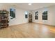 Bright bonus room with hardwood floors, natural light, and shelves ideal for displaying games at 1045 Shepherds Ne Ln, Atlanta, GA 30324