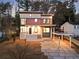 Modern two-story home featuring clean lines, a carport, and a stylish stone pathway to the front door at 1045 Shepherds Ne Ln, Atlanta, GA 30324