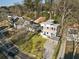 Two-story modern home with a stone driveway and a carport situated in a lush, tree-filled neighborhood at 1045 Shepherds Ne Ln, Atlanta, GA 30324