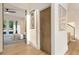 Hallway leading to bedroom with access to patio and decorative wall art at 1045 Shepherds Ne Ln, Atlanta, GA 30324