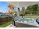 Backyard view of a hot tub with partially covered fence and foliage at 1045 Shepherds Ne Ln, Atlanta, GA 30324
