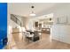 Open concept living space, showcasing hardwood floors, modern staircase, dining table, and gourmet kitchen at 1045 Shepherds Ne Ln, Atlanta, GA 30324