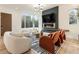 Comfortable living room featuring a modern fireplace, stylish seating, and lots of natural light at 1045 Shepherds Ne Ln, Atlanta, GA 30324