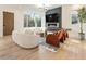 Stylish living room with fireplace, modern lighting, hardwood floors, comfortable seating and decor at 1045 Shepherds Ne Ln, Atlanta, GA 30324