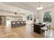 Bright open-concept area featuring the kitchen, dining and living areas all with hardwood floors at 1045 Shepherds Ne Ln, Atlanta, GA 30324