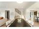 Open-concept living space featuring a modern staircase and hardwood floors at 1045 Shepherds Ne Ln, Atlanta, GA 30324