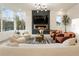 Cozy living room featuring a linear fireplace, lots of seating and natural light from many windows at 1045 Shepherds Ne Ln, Atlanta, GA 30324