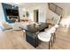 Spacious open-concept living area with modern decor, a dining area and beautiful hardwood floors at 1045 Shepherds Ne Ln, Atlanta, GA 30324