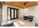 Covered patio with wood ceiling, ceiling fan, and outdoor seating area at 1045 Shepherds Ne Ln, Atlanta, GA 30324