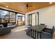 Screened porch featuring a ceiling fan, comfortable seating, and dining area with a view of backyard at 1045 Shepherds Ne Ln, Atlanta, GA 30324
