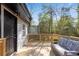 Cozy back deck with a modern outdoor seating area, perfect for relaxing and enjoying the scenery at 2072 Baker Nw Rd, Atlanta, GA 30318