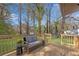 Inviting back deck with comfortable seating and charming views of the outdoors at 2072 Baker Nw Rd, Atlanta, GA 30318