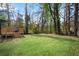 Spacious backyard with lush green grass and a wooden deck, ideal for outdoor activities and entertaining at 2072 Baker Nw Rd, Atlanta, GA 30318