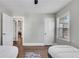 Bedroom with two twin beds, neutral paint, a ceiling fan and hardwood floors at 2072 Baker Nw Rd, Atlanta, GA 30318
