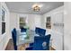 Bright dining room featuring modern table, chairs, lighting, and a washer/dryer combo unit at 2072 Baker Nw Rd, Atlanta, GA 30318