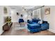 Cozy living space with a plush blue sofa, sleek flooring, and a modern entertainment center at 2072 Baker Nw Rd, Atlanta, GA 30318