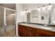 Elegant bathroom with double sinks, granite countertops, and a glass-enclosed shower at 3400 Malone Dr # 110, Atlanta, GA 30341