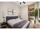 Bright bedroom featuring a neutral palette, contemporary art, and a large window for natural light at 3400 Malone Dr # 110, Atlanta, GA 30341