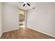 Sun-drenched bedroom showcasing a window with blinds and warm, wood-look flooring at 3400 Malone Dr # 110, Atlanta, GA 30341