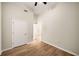 Empty bedroom with hardwood floors and two doors at 3400 Malone Dr # 110, Atlanta, GA 30341