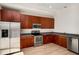 Well-equipped kitchen with stainless steel appliances, wooden cabinets, and granite countertops at 3400 Malone Dr # 110, Atlanta, GA 30341
