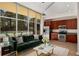 Bright living room featuring floor-to-ceiling windows and an open concept kitchen with stainless steel appliances at 3400 Malone Dr # 110, Atlanta, GA 30341