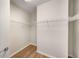 Walk-in closet with wood-look floors and wire shelving for optimal storage at 3400 Malone Dr # 110, Atlanta, GA 30341