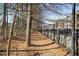 A tree lined mulch walking path is located next to the condo community at 3400 Malone Dr # 110, Atlanta, GA 30341