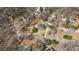 Aerial view of the property surrounded by trees and neighborhood streets at 6510 Akins Way, Cumming, GA 30041