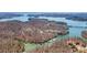 Stunning aerial view of a lakeside community with multiple boat docks and lake access at 6510 Akins Way, Cumming, GA 30041