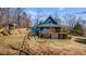 Spacious backyard with a playhouse and slide, perfect for outdoor fun at 6510 Akins Way, Cumming, GA 30041
