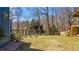 Backyard with garden planters and water feature with access to raised patio at 6510 Akins Way, Cumming, GA 30041