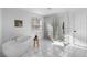 Clean bathroom features a soaking tub and glass block shower at 1824 Windemere Ne Dr, Atlanta, GA 30324